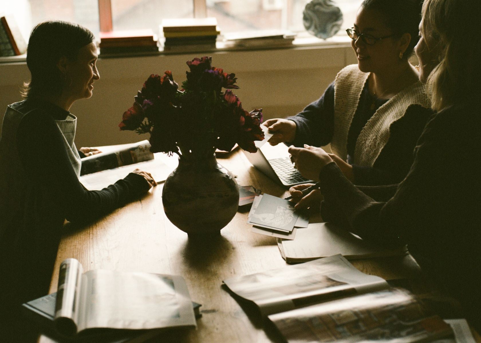 The Partnership Editions team readjusting the studio space, ready to assist with any inquiries.