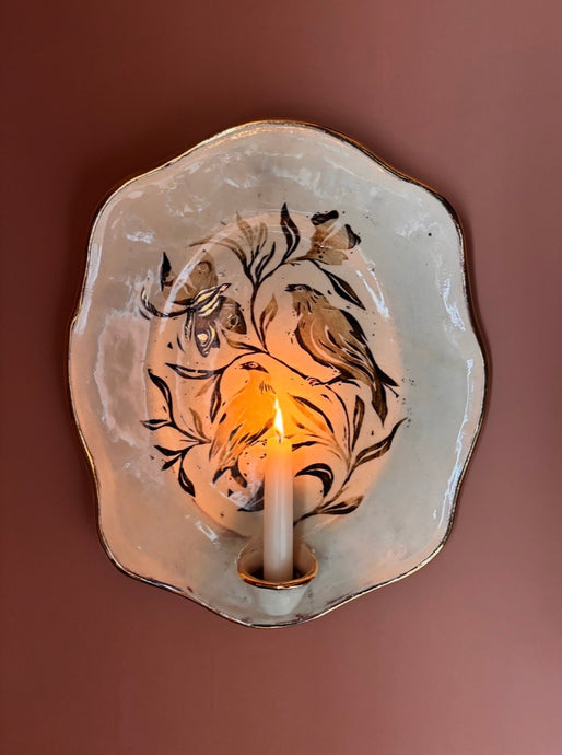 Bird and moth sconce