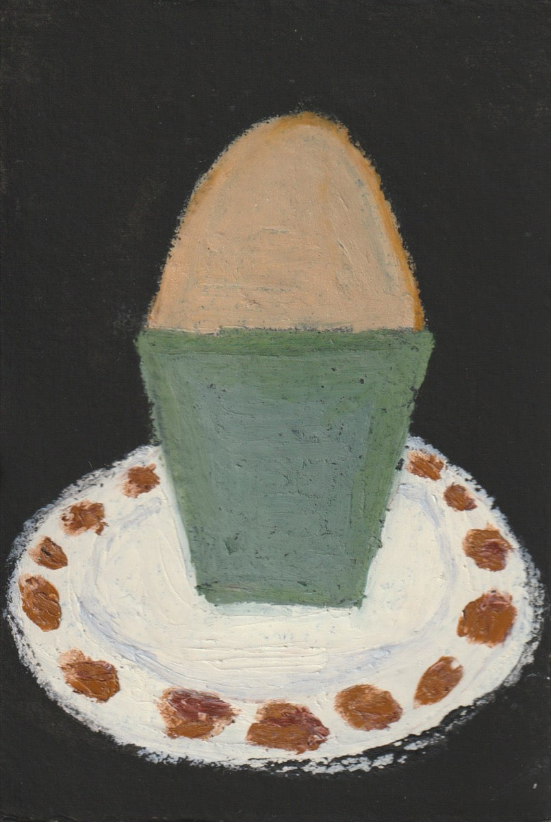 Egg cup, green and blue on white and brown dish