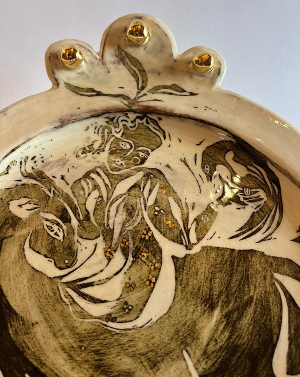 'No feeling is final' trefoil plate
