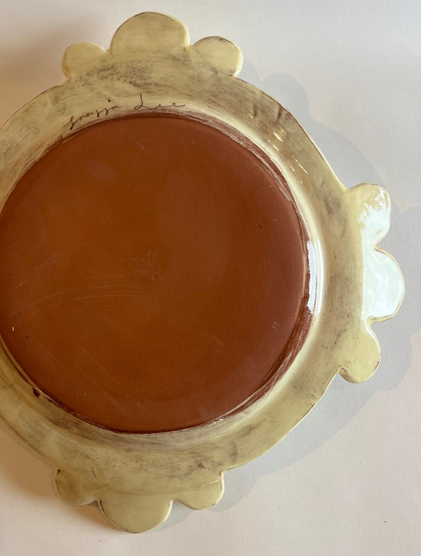 'No feeling is final' trefoil plate