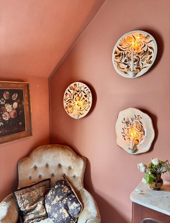 Bird and moth sconce