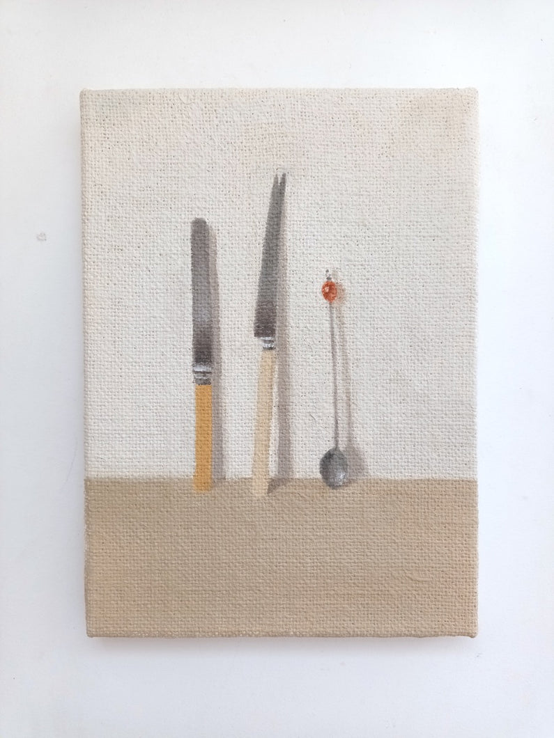 Two knives and a spoon