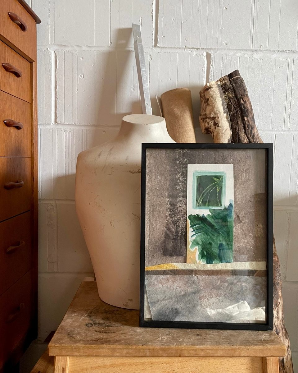 Framed contemporary artwork by Adriana Jaros leaning against a wall in her studio for Partnership Editions.