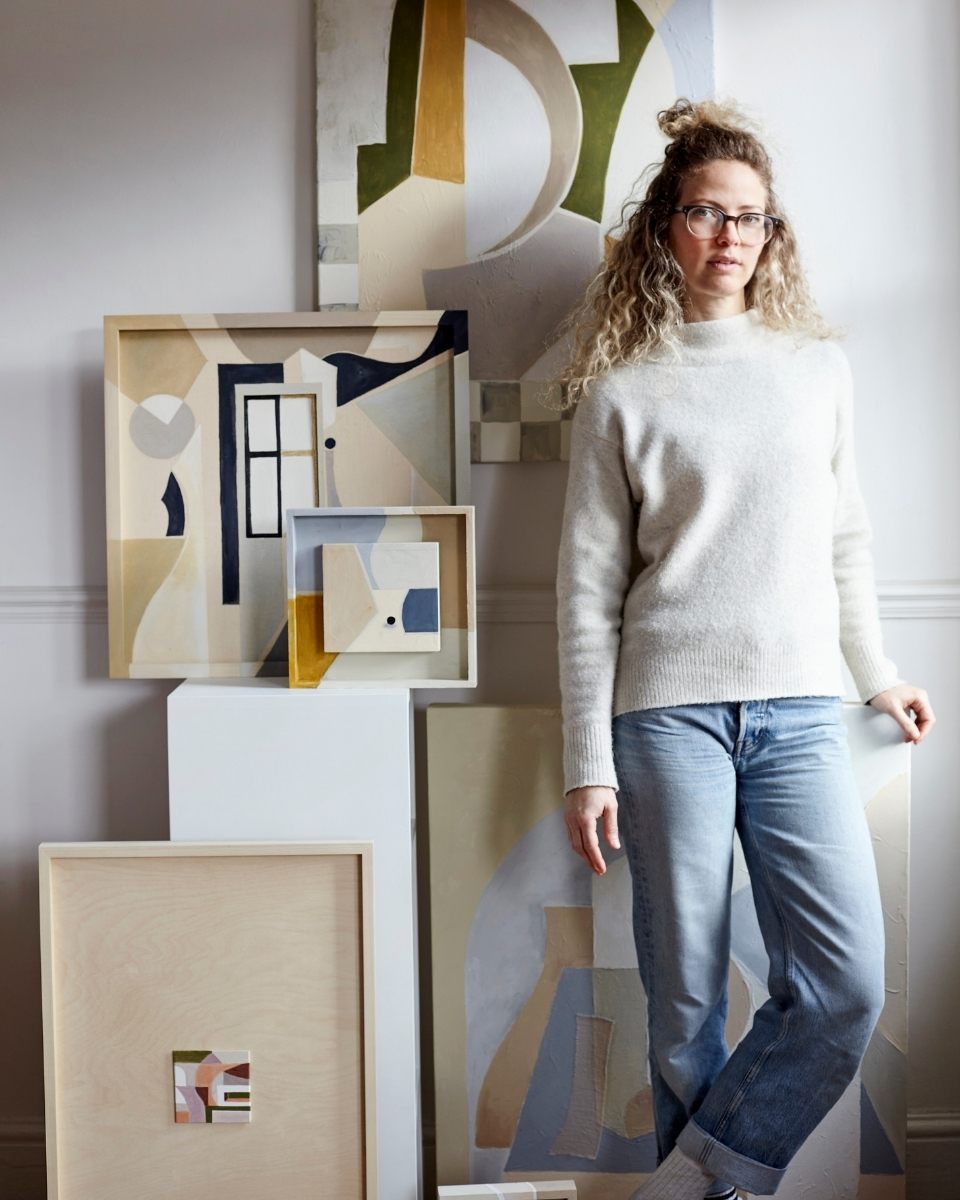 Portrait of artist Adriana Jaros in her studio by her contemporary paintings for Partnership Editions.