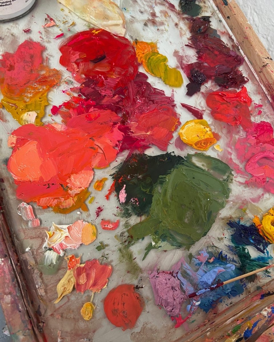 Close-up detail of oil paints and brushwork used by Amy Dury in her artist studio for Partnership Editions.