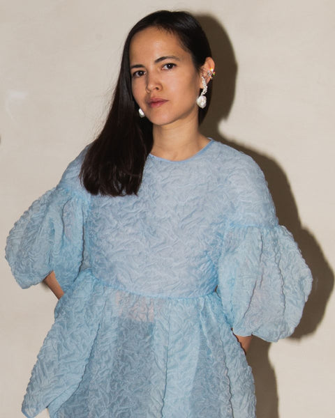 A professional portrait of Completedworks artistic director Anna Jewsbury, serving as a judge on the selection committee for the Partnership Editions Artist Open Call 2026.