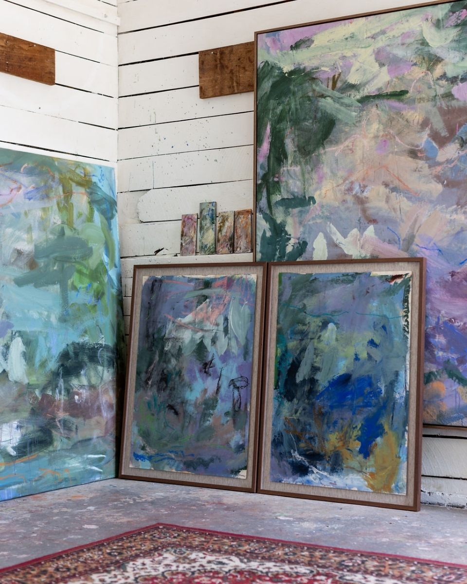 Two matching, twin-sized framed gestural abstract artworks displayed inside Bethany Holmes’ painting studio.