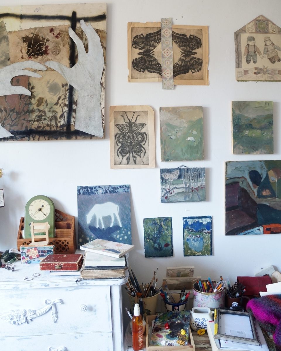 Wall detail of Bethenie Carriaga’s studio gallery wall, showcasing a collection of her finished paintings and works for Partnership Editions.
