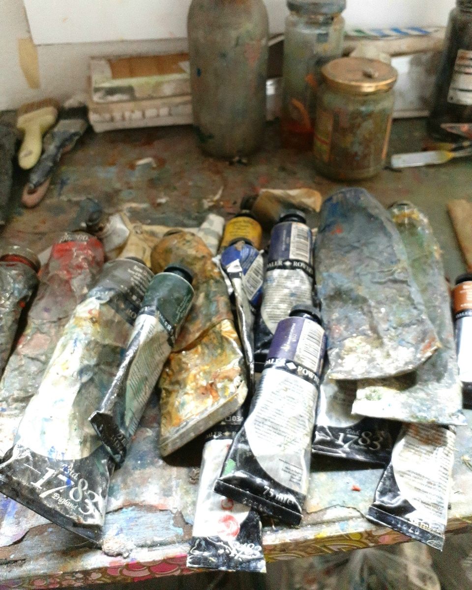 Carousel image showcasing the oil paints and artist materials used by Brendan Lancaster in his studio for Partnership Editions.