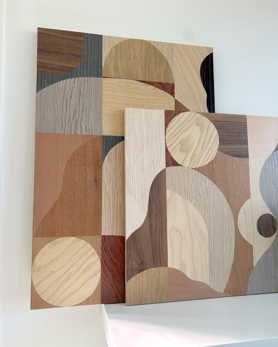Chelsea Vivash original wooden marquetry compositions leaning on a studio wall for the September Drop 2024 at Partnership Editions.