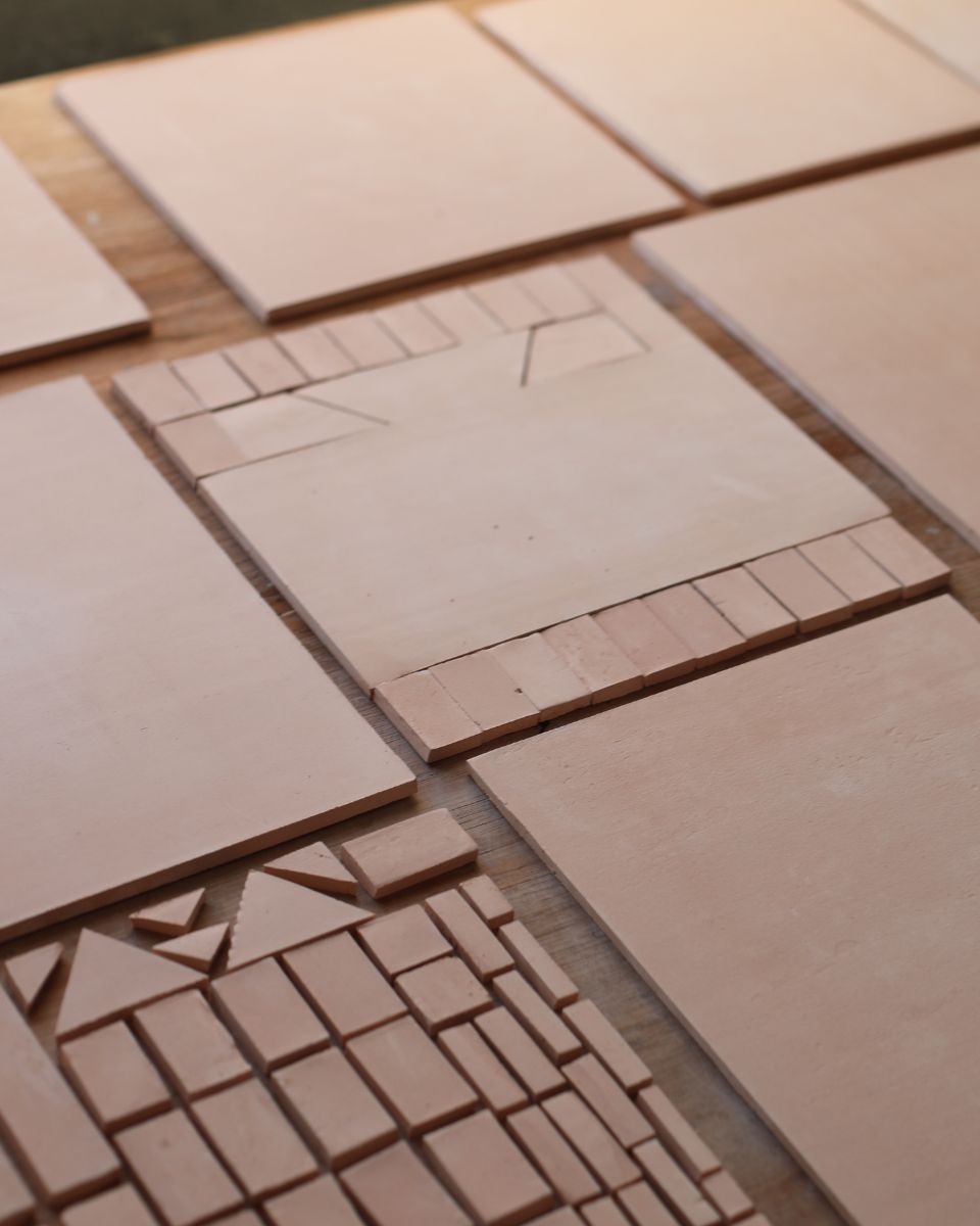 Daniel Dzonu-Clarke’s clay base layers ready for paint on his worktable for Partnership Editions.