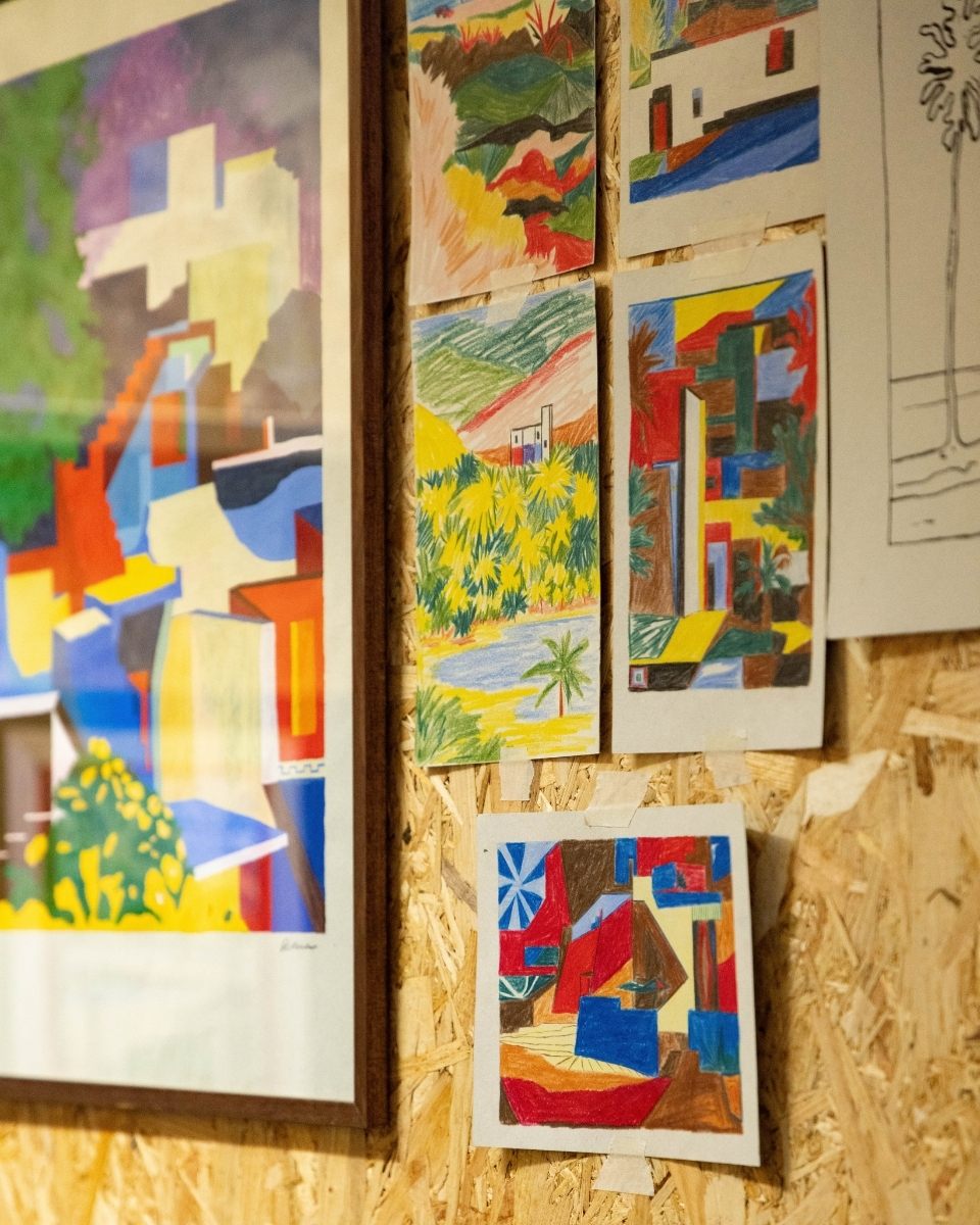 Detail shot of Daniel Dzonu-Clarke’s studio showcasing expressive paper drawings and a framed painting by the artist for Partnership Editions.