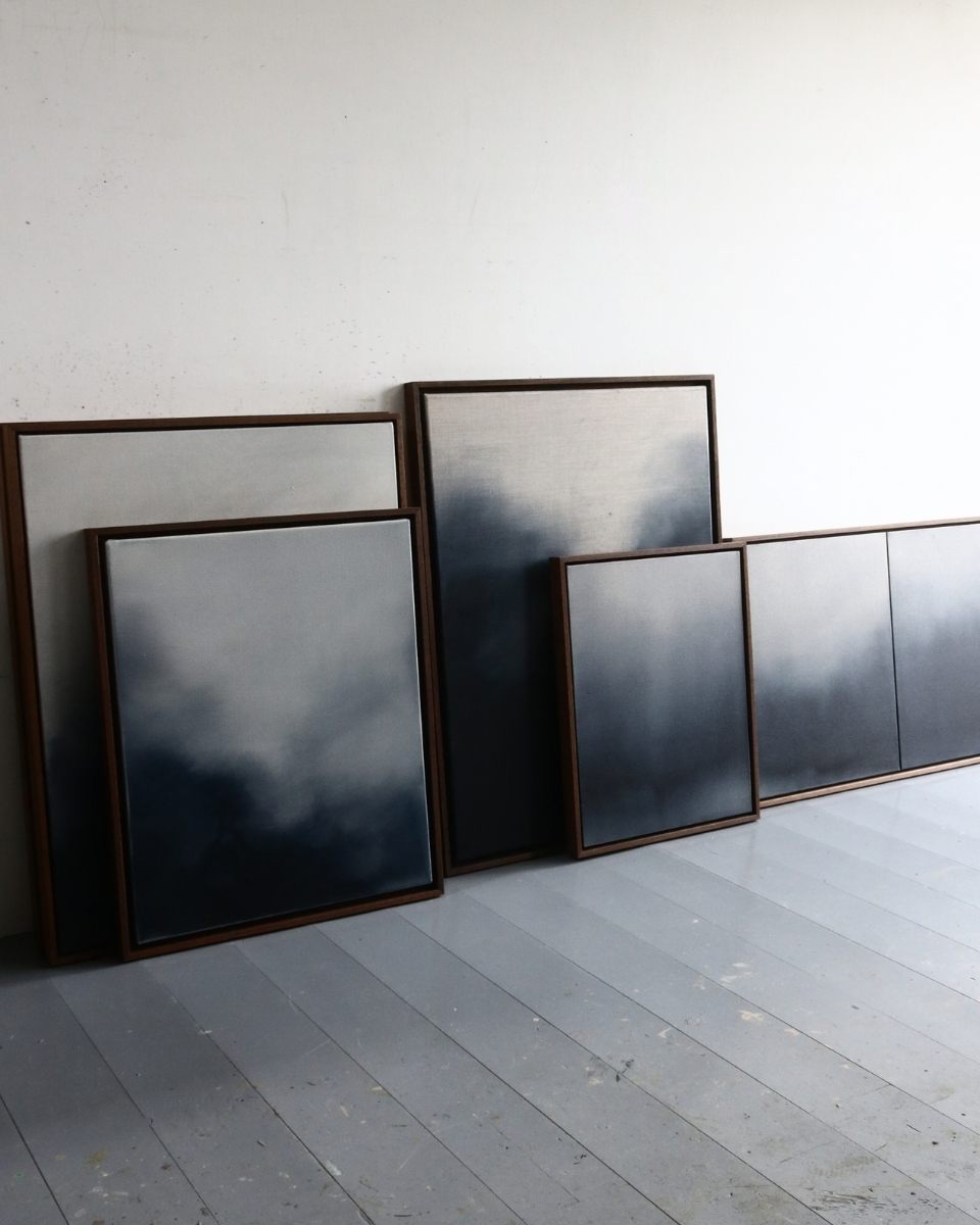 Studio shot of David Hardy’s contemporary framed canvases leaning against a wall in his artist workspace for Partnership Editions.