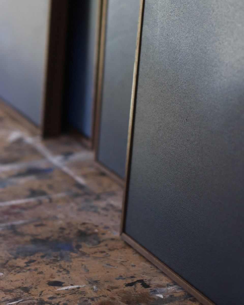 Close-up detail of textured abstract canvases in David Hardy’s studio, showcasing his reductive painting style for Partnership Editions.