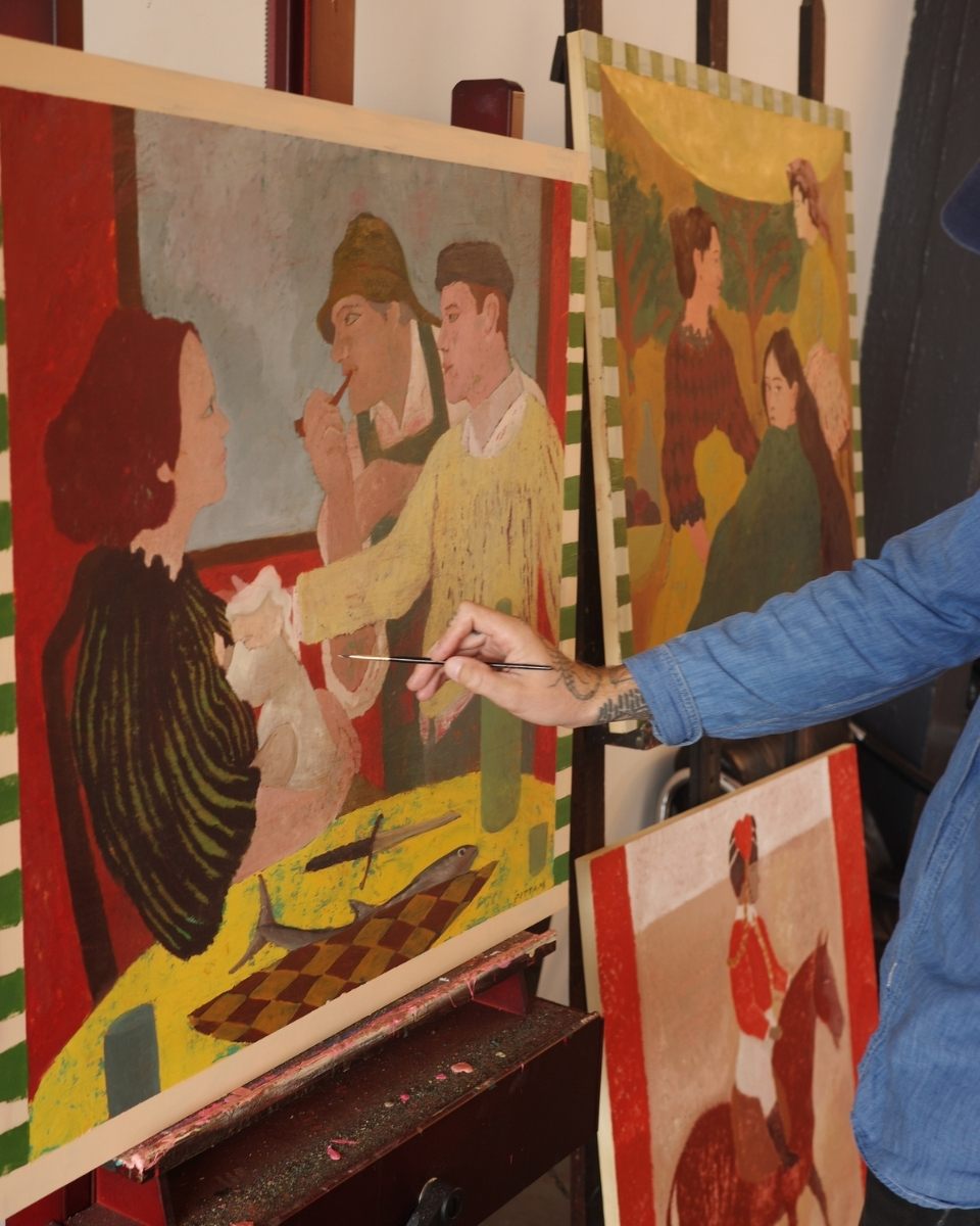 Close-up detail of artist Elliott Pittam’s hand painting a contemporary figurative artwork in his studio for Partnership Editions.