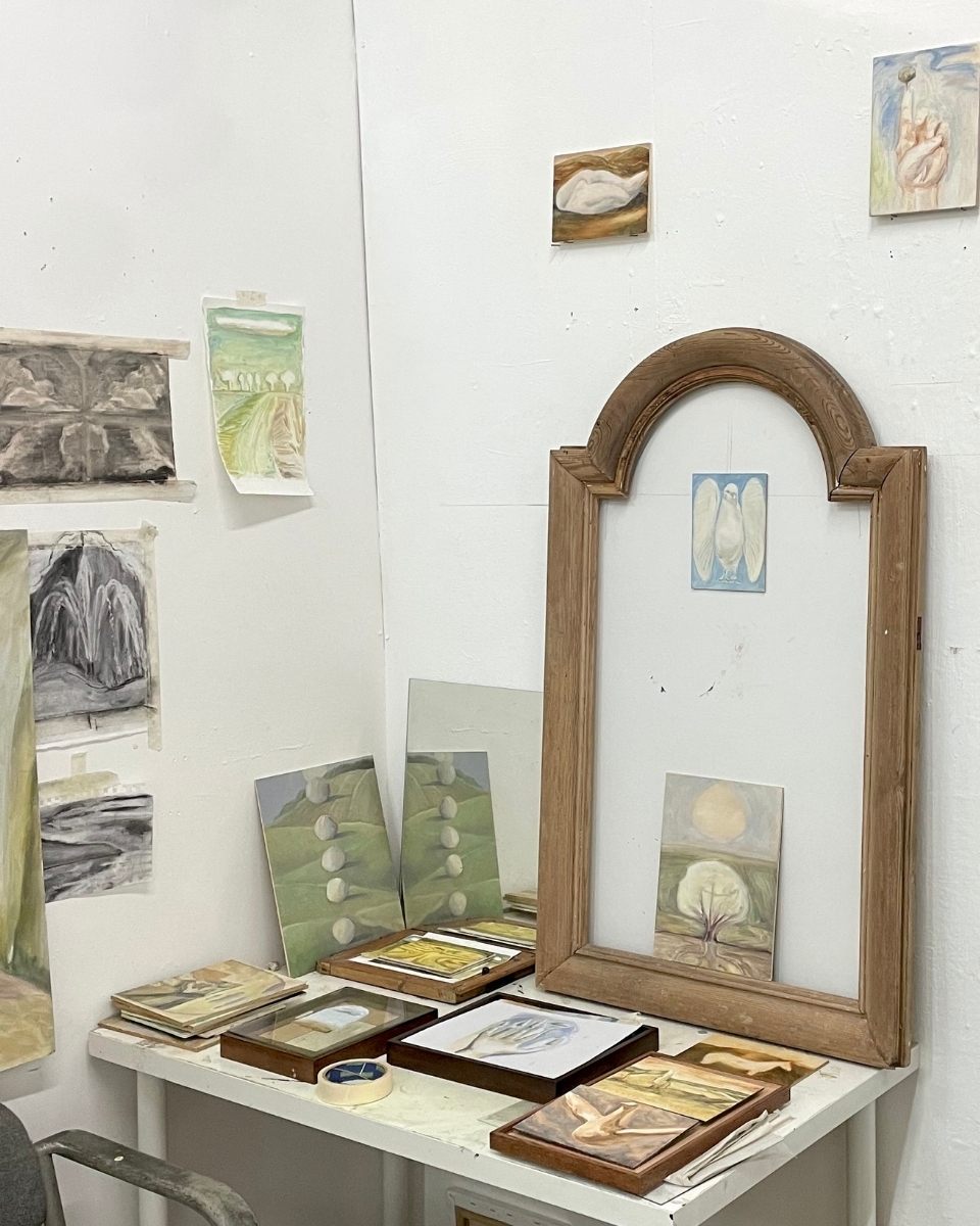 Carousel image of a corner in Hattie Landells’ artist studio, showcasing contemporary paintings, sketches, and drawings for Partnership Editions.
