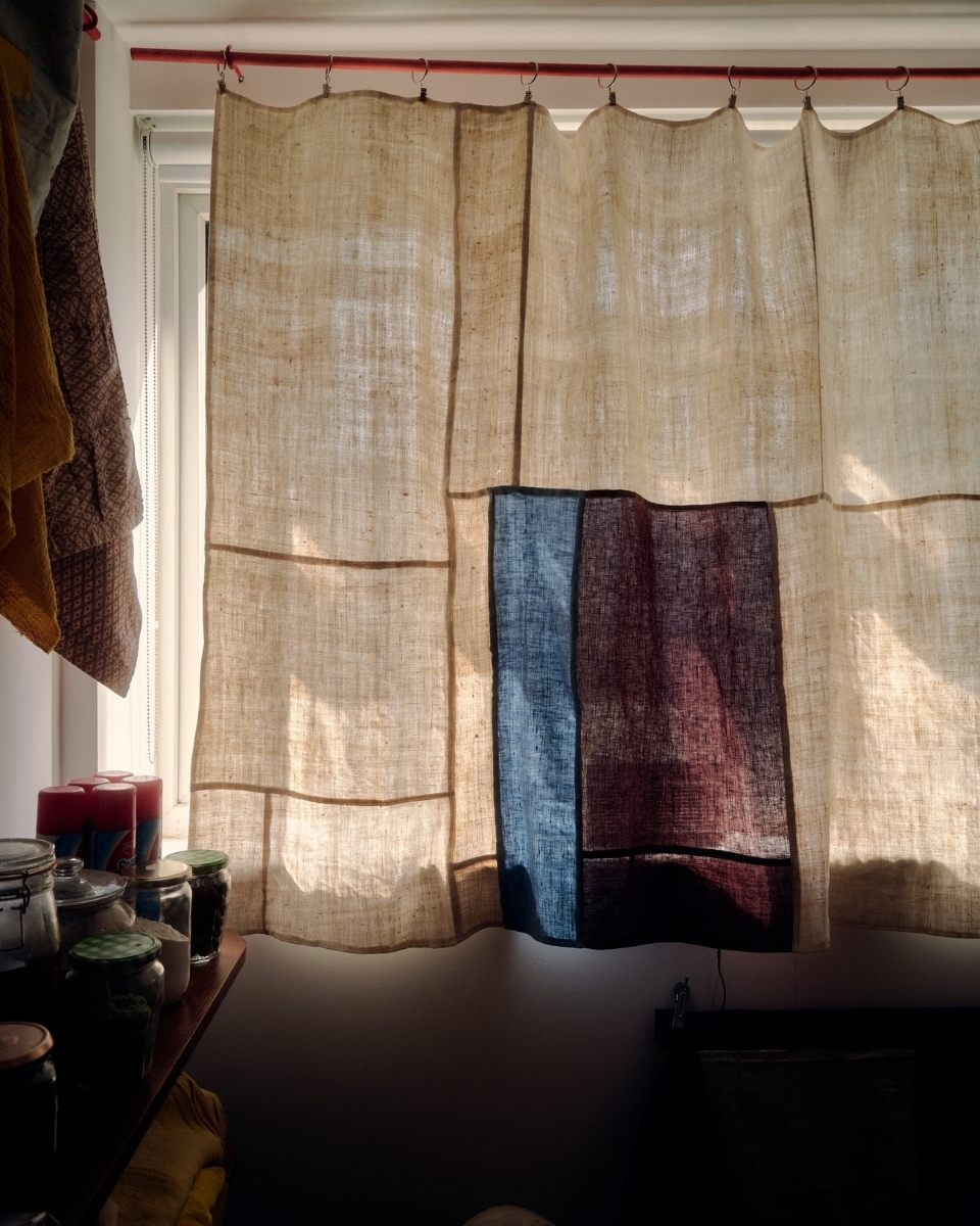 Close-up shot of a textured, hand-stitched linen curtain by Isabel Farchy in her studio house for Partnership Editions.