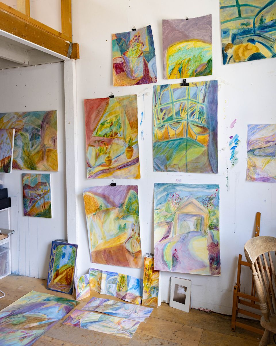 Studio wide shot of Isabel Garfield’s vibrant and colourful watercolour paintings and sketches displayed on her studio wall for Partnership Editions.