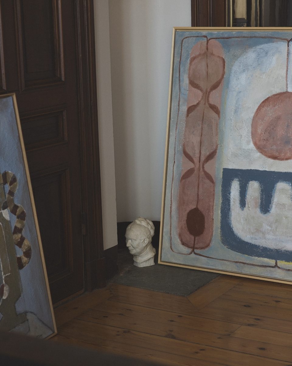 Detail shot of a textured Josefin Tolstoy abstract painting leaning against a studio wall, showcasing her expressive brushwork.
