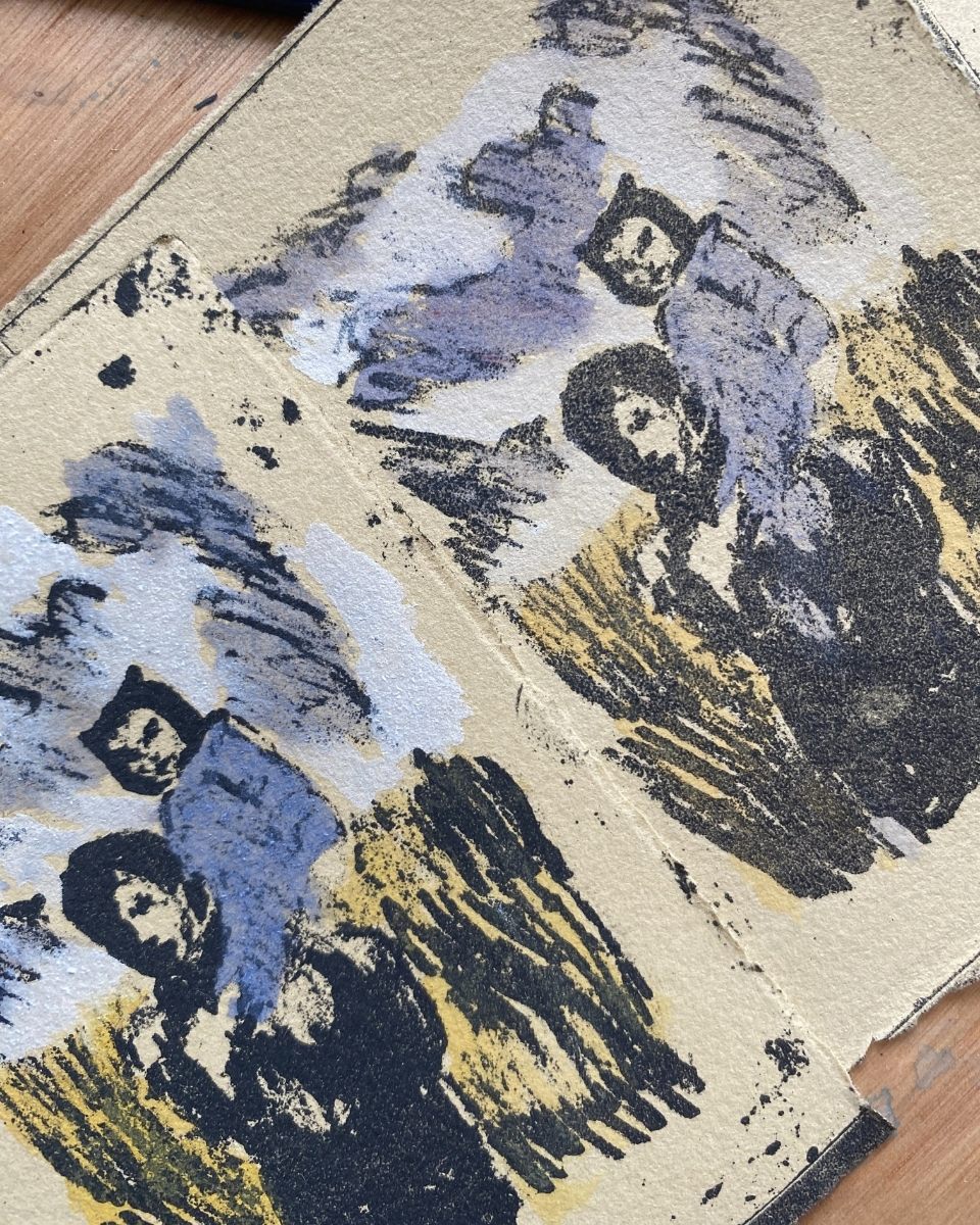 Close-up detail of Josephine Birch’s narrative artworks on heavy-weight paper, featuring soft washes in her studio.