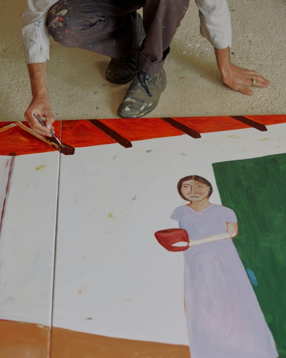 Close-up of Joshua Perkin’s hand applying thick, textured oil paint to a contemporary figurative artwork for Partnership Editions.