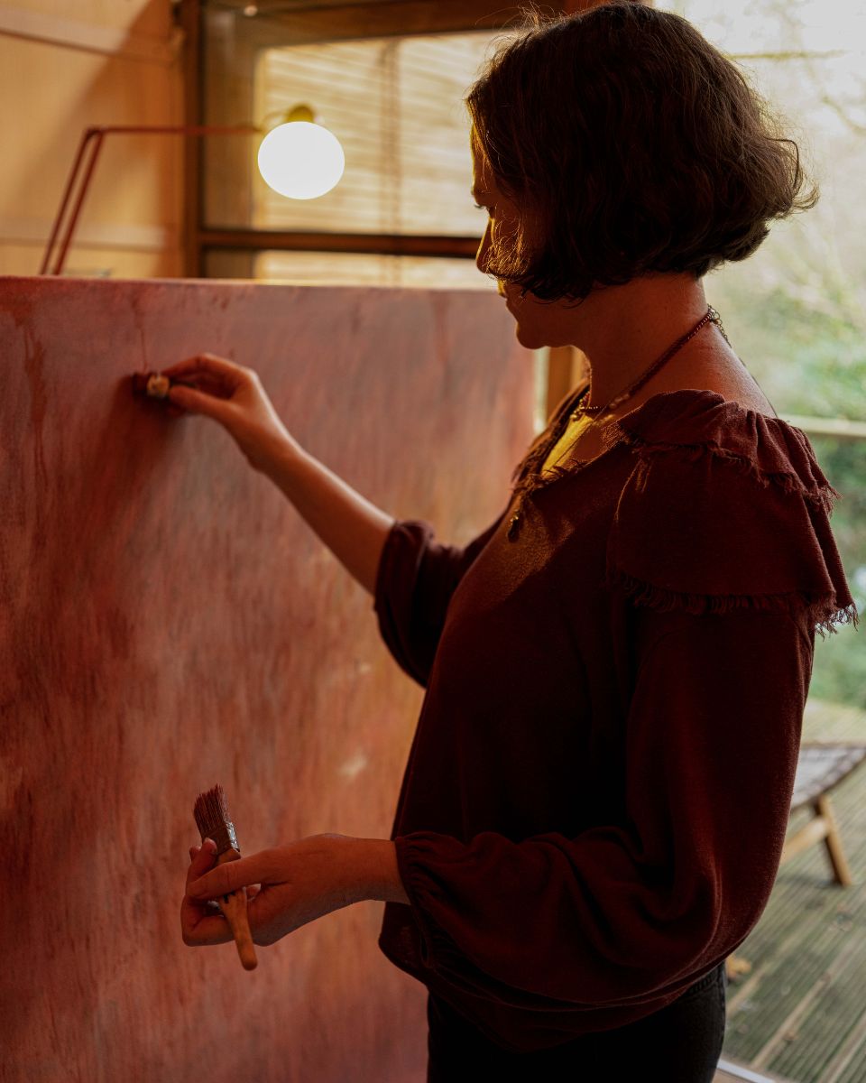 Close-up shot of Julianna Byrne finalising a detailed artwork in her studio for Partnership Editions.