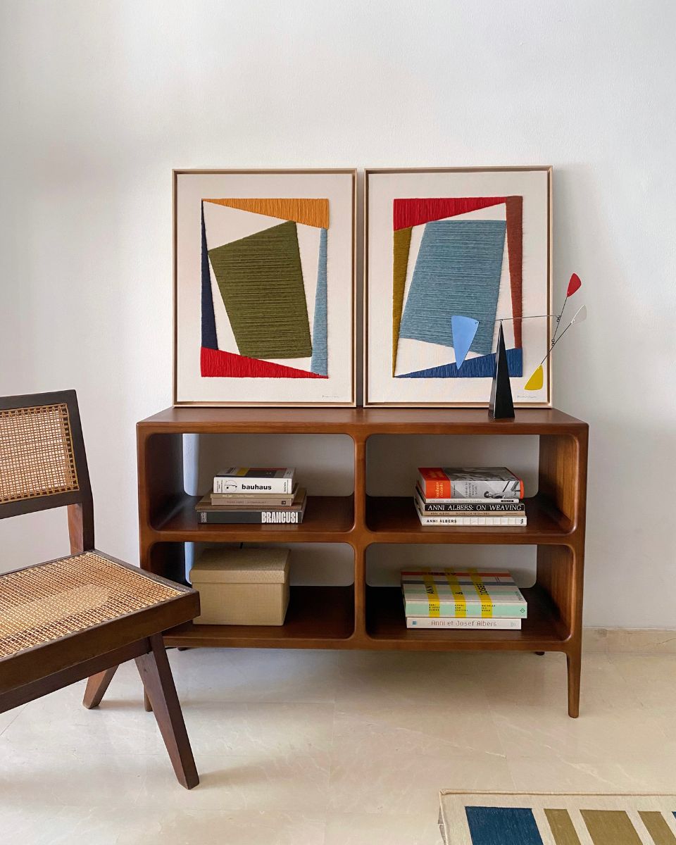 Kanica framed graphic artworks displayed on a wooden storage block in a living room for the September Drop 2024 at Partnership Editions.