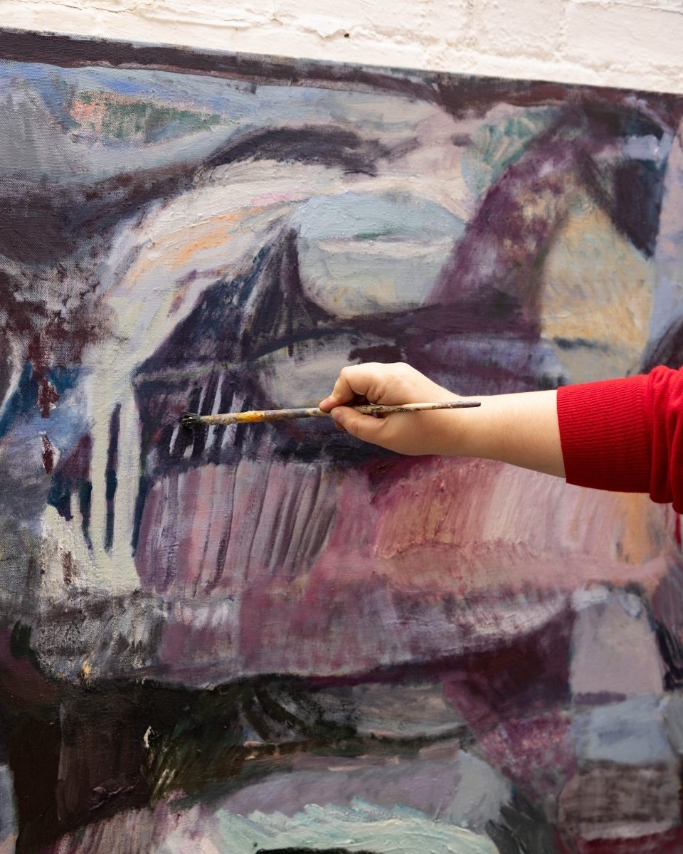 Action shot of Katarina Lalic applying final touches, weaving observed natural elements into a cohesive abstraction.