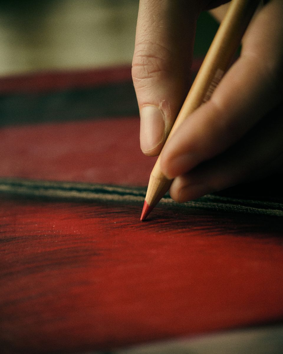 Close-up macro detail shot of coloured pencil textures on heavy paper, showing Keziah Mornin’s layering process.