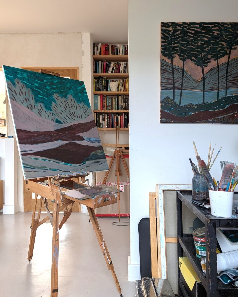 A work-in-progress painting on an easel in Kulbir Bhandal’s studio, surrounded by architectural drafting tools and pigments.