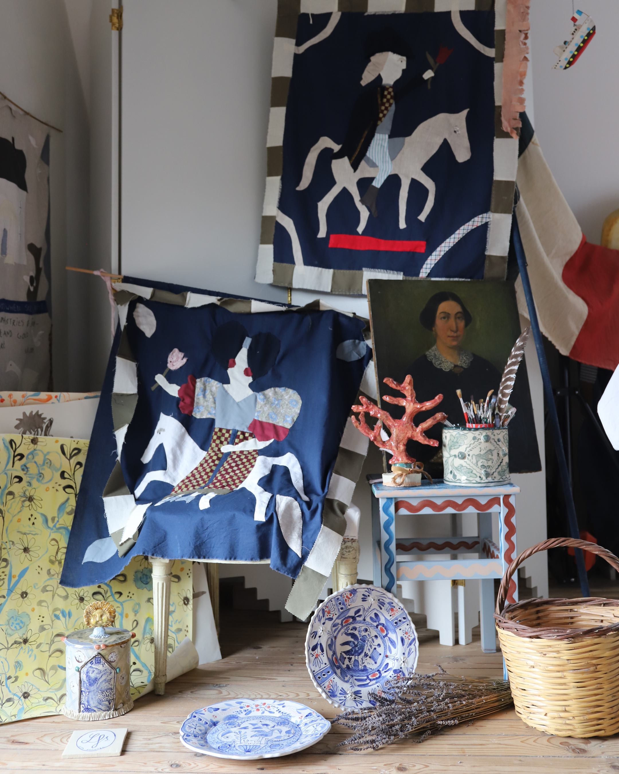 A behind-the-scenes view inside artist Lisa Sandner's studio featuring new contemporary artwork and creative process details for the homepage What's New section.