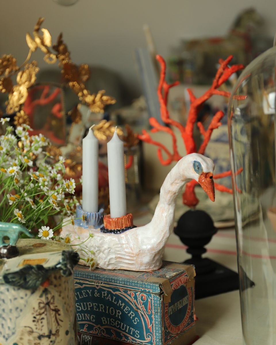 Hand-built Cygne (Swan) candlestick artwork in situ for Lisa Sandner’s On Believing Collection at Partnership Editions.