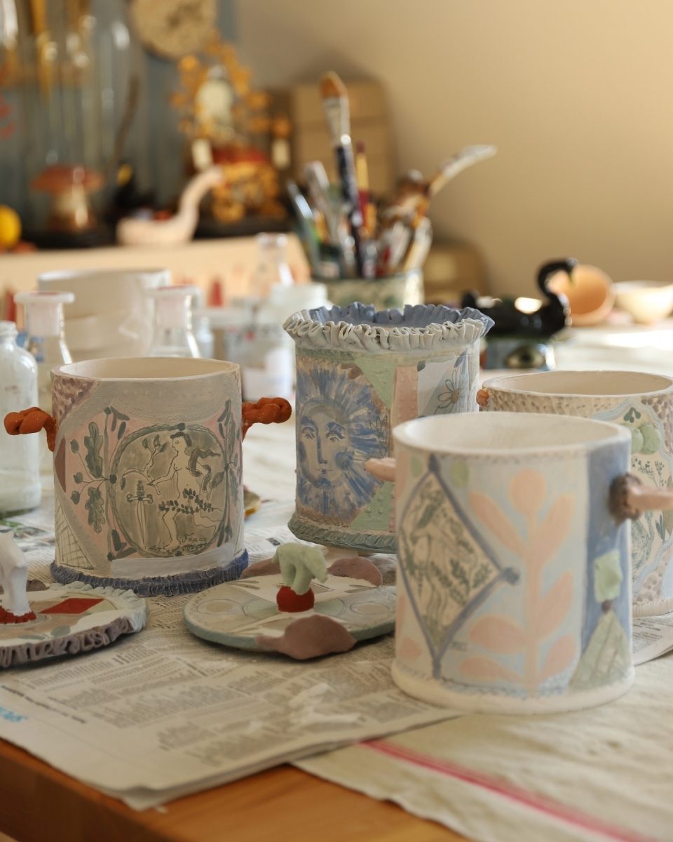 Close-up of Lisa Sandner’s unfinished stoneware vases, showcasing her signature gestural patterns and earthy colour palette.
