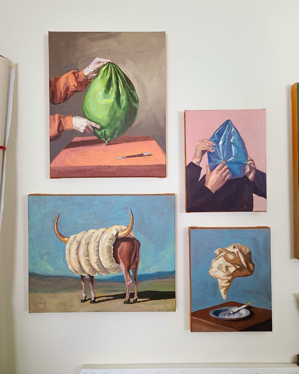 Studio wall shot featuring four mounted paintings by Mamie Young, exploring themes of vulnerability and material culture.