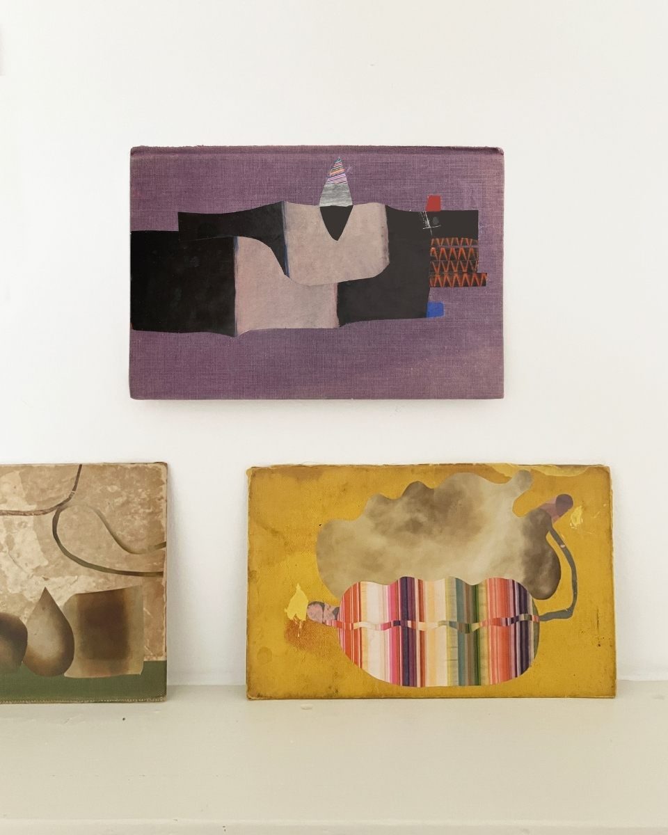 Detail shot of three Matthew Richardson mixed-media artworks arranged on a workspace, showcasing his consistent colour palette and form.