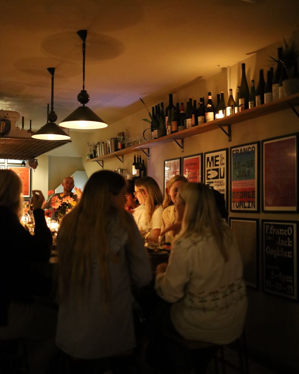 Guests and collectors enjoying the Open Call Winners 2022 dinner at P. Franco in East London.