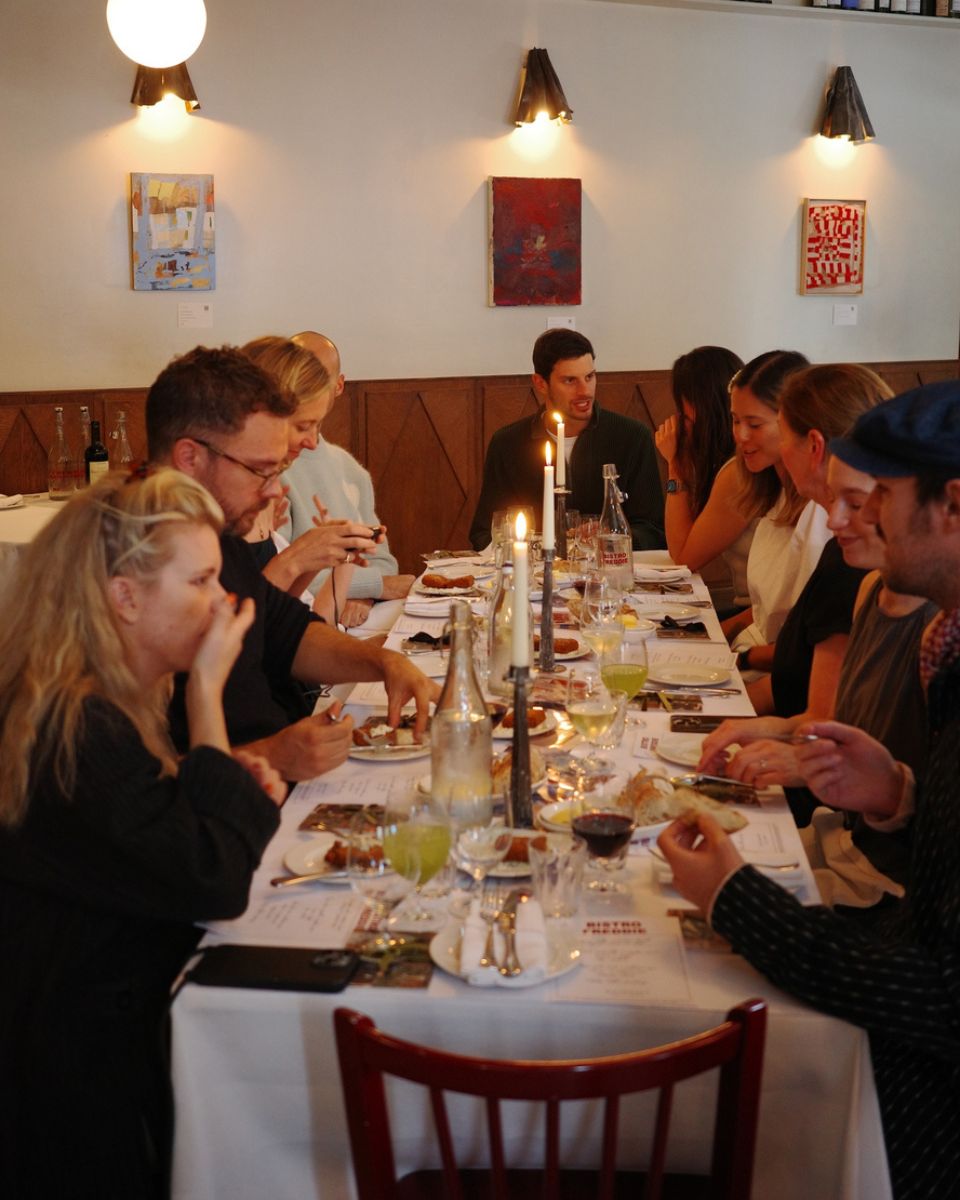 Artists and collectors enjoying an intimate dinner at Bistro Freddie’s for the Open Call Winners Collection 2024 at Partnership Editions.