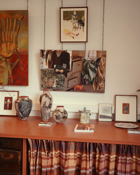 Hackney studio wall and desk display with artwork in the Studio section of Partnership Editions Advisory.