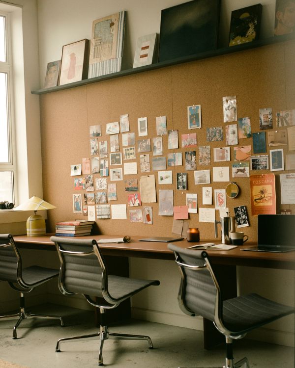A small thumbnail preview of a beautifully arranged Partnership Editions office desk for the website's About page footer icon