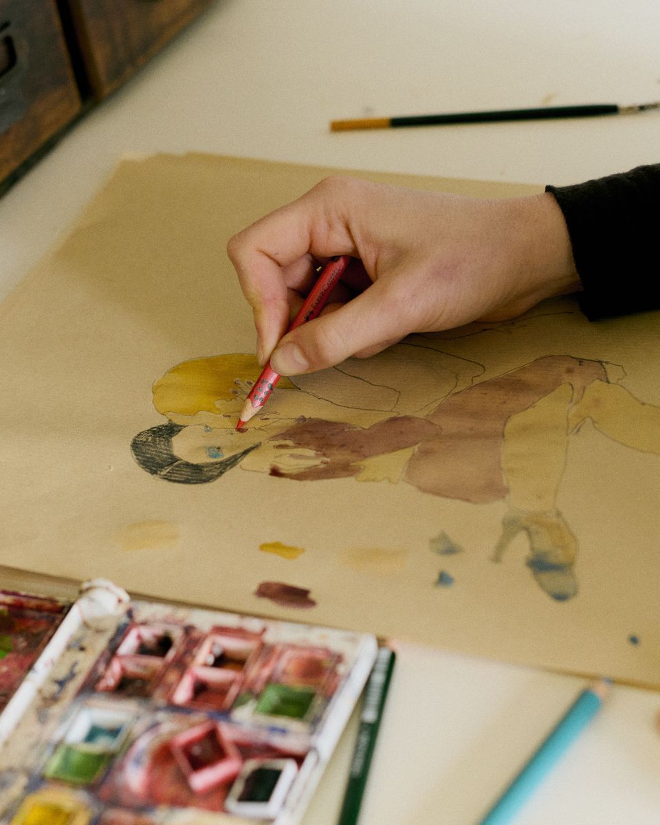Macro detail shot of Phoebe Howard's intricate pencil linework and sketching process on paper.