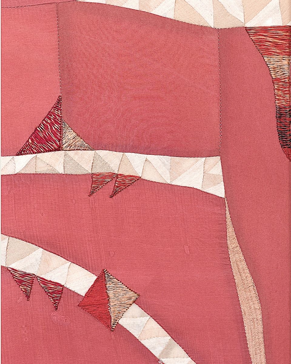 Detailed close-up of a colourful, improvisational geometric patchwork textile artwork by maker Phong Chi Lai.