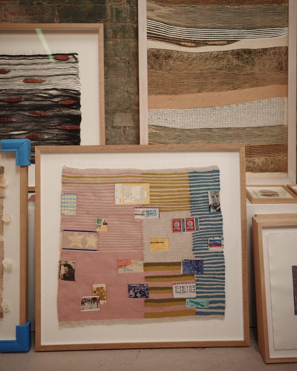 Detail shot of a framed Rachna Garodia textile piece, showcasing the intricate texture of silk, hemp, and nettle fibers woven with botanical finds.