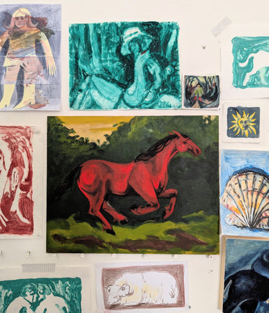Red horse in a green landscape