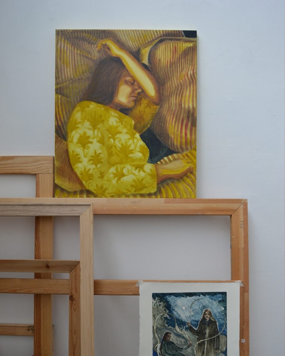 Close-up of small-scale figurative artworks by Robyn Packham, displayed on handcrafted wooden frames.