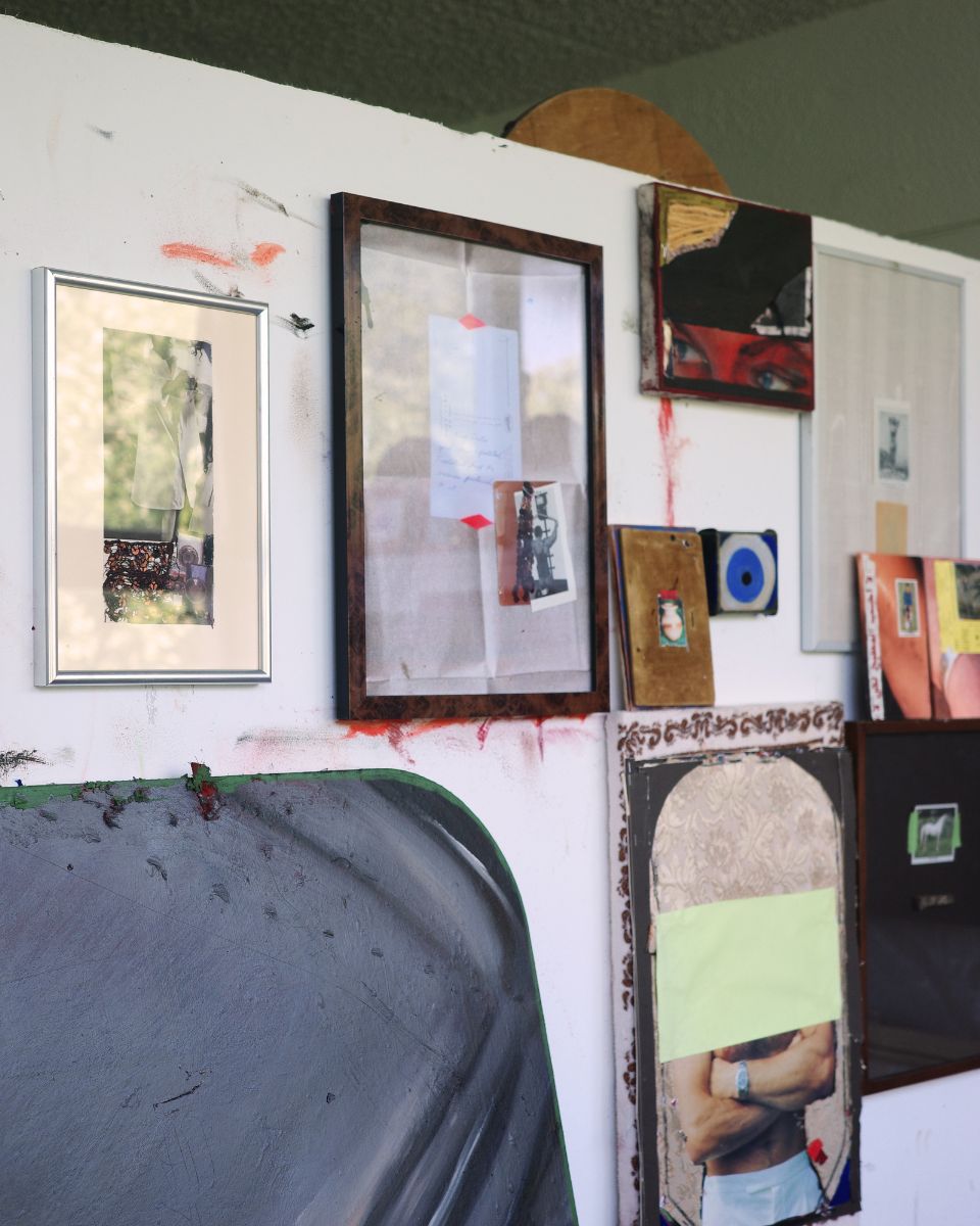 A collection of framed and unframed contemporary mixed-media artworks displayed inside Ruba Nadar's studio.