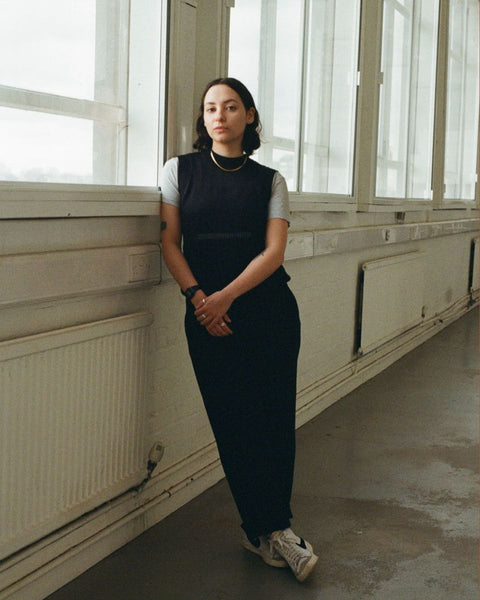 A professional portrait of curator and artist Seren Metcalfe, serving as a judge on the selection committee for the Partnership Editions Artist Open Call 2026.