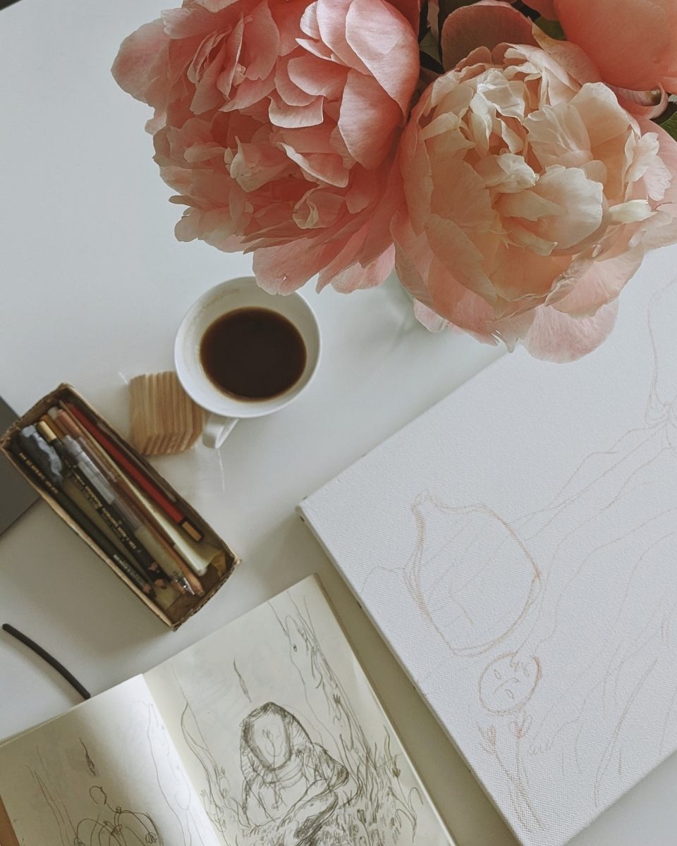 A top-down close-up of Shaoyu Chen’s open sketchbooks.