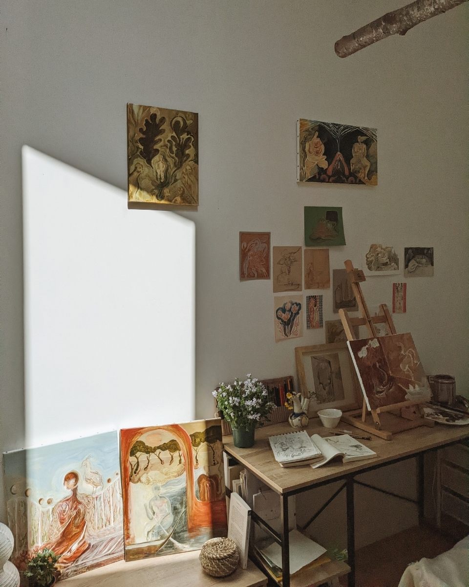 A curated wall in Shaoyu Chen’s studio showcasing a mix of mounted and unmounted mixed-media paintings and paper studies.