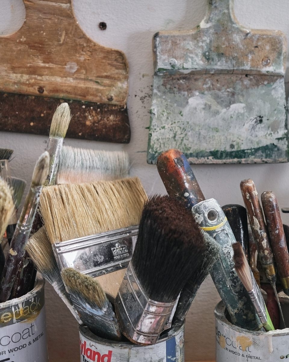 Macro close-up of Simon Job’s well-used paintbrushes.
